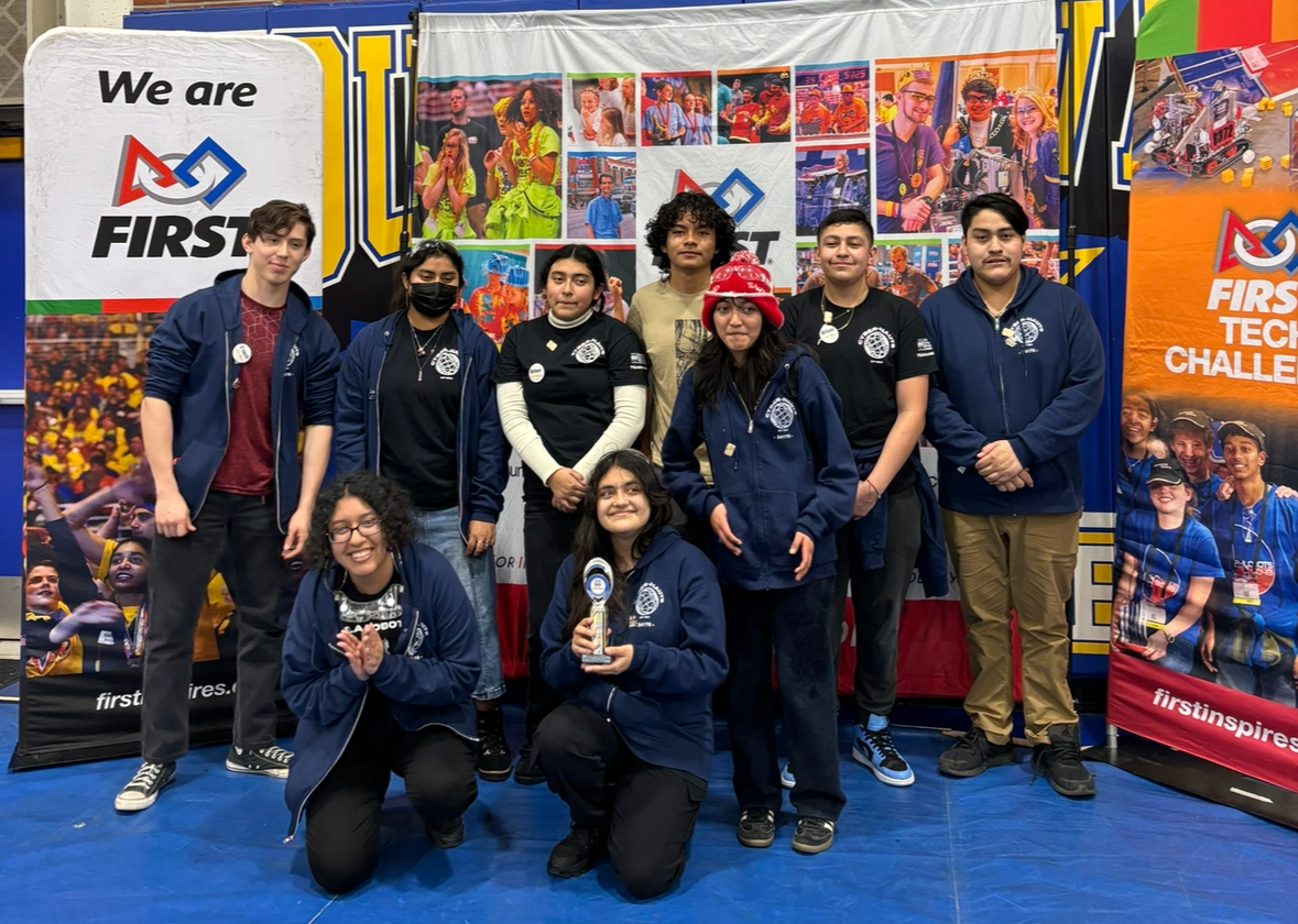 Team picture of the CYVER-NAUTS with their robot, J3FF